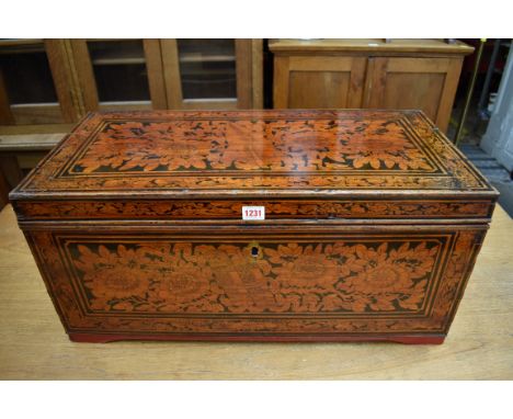 An old Eastern painted and stained wood trunk,&nbsp;with partially fitted interior, 70.5cm wide.&nbsp; 