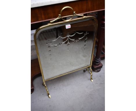 A brass and mirrored glass fire screen,&nbsp;47.5cm wide.&nbsp; 