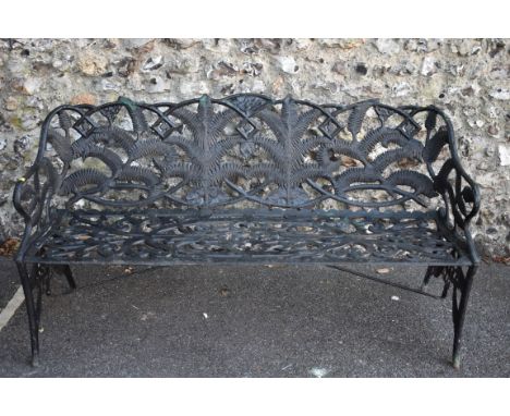 A black painted steel garden bench decorated stylised ferns and floral scrolls, 153cm wide.&nbsp;This lot can only be collect
