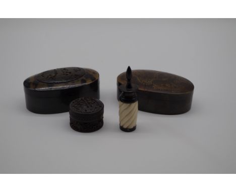 A small Chinese carved tortoiseshell circular box and cover,&nbsp;4cm diameter; together with two tortoiseshell oval boxes an