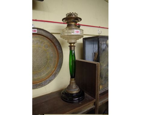 An old brass and coloured glass oil lamp. 