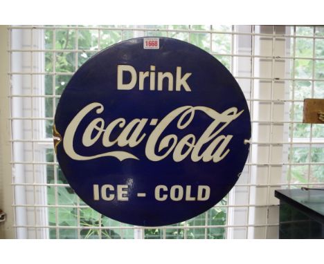 A vintage blue enamel 'Drink Coca-Cola Ice Cold' circular sign,&nbsp;42.5cm diameter. 