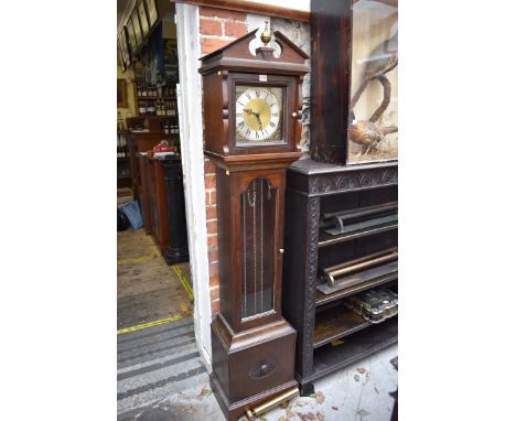 An oak reproduction longcase clock, 179cm high, with weights and pendulum. 