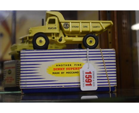 Dinky Toys:&nbsp;two vintage diecast vehicles, comprising:&nbsp;Euclid Rear Dump Truck No.965; and Fire Engine No.555, both b