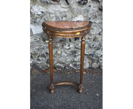 A small 18th century giltwood console table, having rouge marble inset top, 43cm wide, (marble cracked).&nbsp;This lot can on