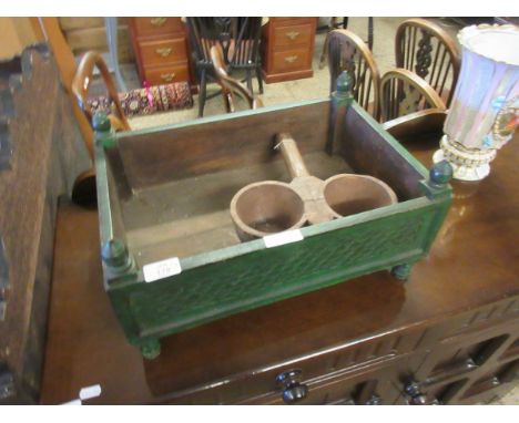 EASTERN HARDWOOD GREEN PAINTED AND CARVED TROUGH WITH FINIAL SUPPORTS TOGETHER WITH A FURTHER DOUBLE COLLECTION CUP    