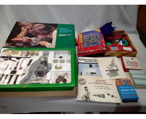 Prinz Student 750z microscope outfit, appears new/unused also box of glass slides, magic set, and fifty must do card set. P&a