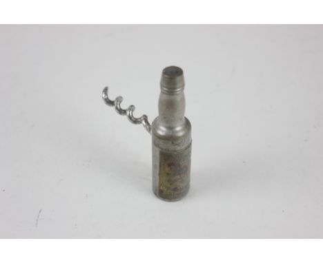 A Williamson's Roundlet bottle corkscrew with applied label advertising Dewars Scotch Whiskey, 7.5cm
