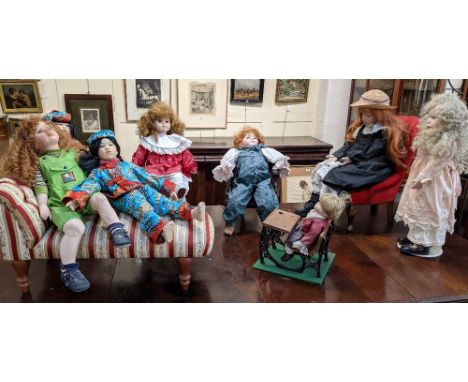 A collection of Victorian style doll's furniture to include an upholstered chaise longue, button back chair, occasional chair