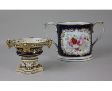 A Grainger &amp; Co Worcester porcelain loving cup, with floral decorated panel and initials 'J D' on cobalt blue ground with