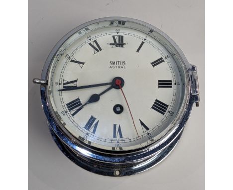 A 20th century 'Smiths Astral' ships bulk head type clock, with key