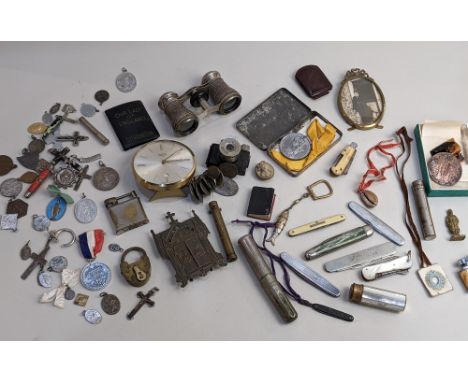 An assortment of collectables to include an Ulca miniature camera, a Swiza calendar clock, devotional medals, mother of pearl