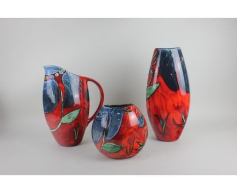 A Poole pottery 'Himalayan Poppy' pattern tall vase, 37cm high, squat vase, 19cm high, and jug, 32cm high