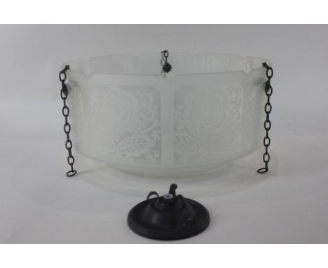 A glass ceiling light fitting, with frosted floral decoration, 35.5cm diameter