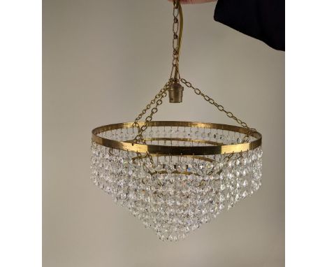 A circular brass five tier chandelier light fitting with hanging glass droplets 30cm diameter