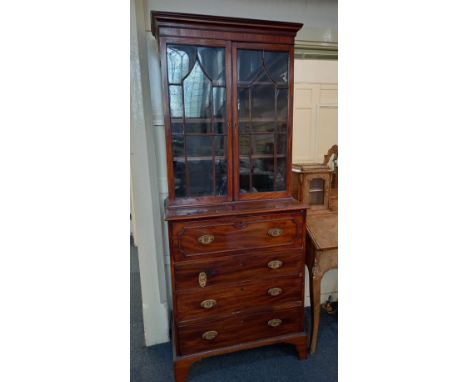 A 19th century mahogany secretaire bookcase, the top with two glazed panel doors enclosing three shelves on base with secreta