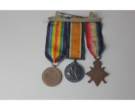 A First World War medal group awarded to PTE J A GREEN MIDD' X R, comprising Victory medal, War medal and 1914-15 star