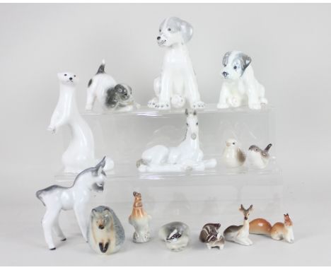 A collection of Russian / USSR ceramic animals to include three dogs, a wren, a hedgehog and a mink