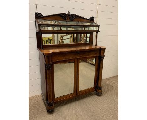 A Victorian mahogany chiffonier with a unique glazed display shelf with hinged lid and two mirrored doors flanked by turned c