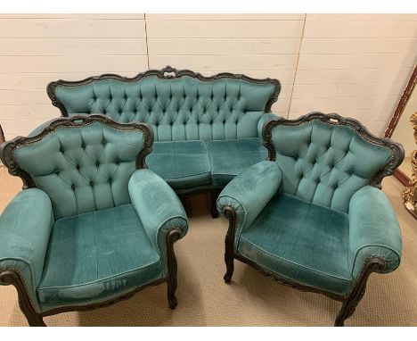 A teal upholstered sofa with scrolled carved shape back and raised on cabriole legs and two chairs (Sofa H90cm W180cm D60cm) 