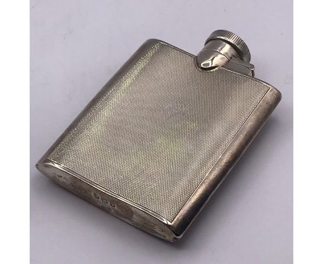 A Machine tooled silver hip flask, hallmarked for Birmingham.