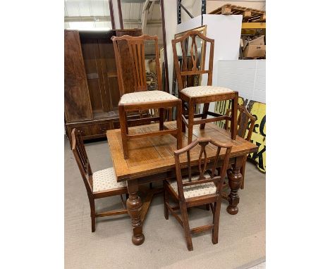 A Pollocks Patent ring turned legged on stretchers oak refectory table with five matching and one other chairs H 77cm x W 107