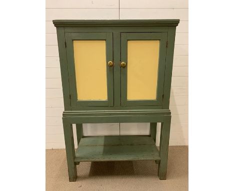 A painted cabinet on stand with shelf under (H150cm W100cm D50cm)