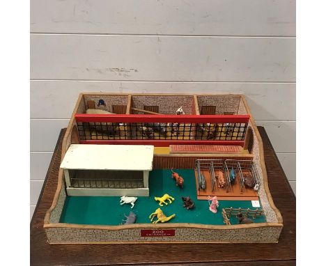 A vintage wooden Zoo play set with some animals 