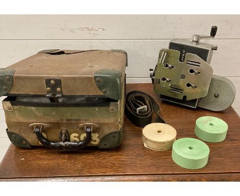 A short range Setright ticket machine and spare rolls 
