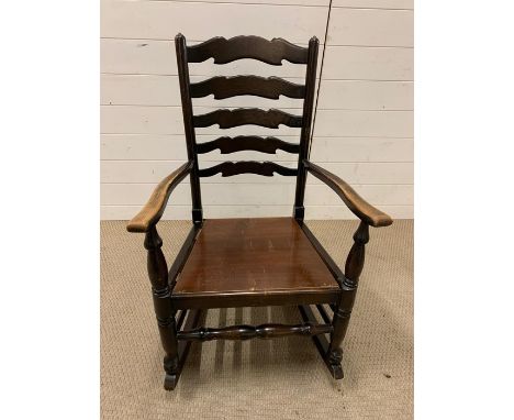 A ladder back rocking chair 