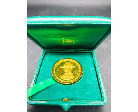 A 22ct gold medal (17.5g) celebrating the 25th Anniversary of the Death of Lord Baden Powell on a 9ct mount.(Total Weight is 