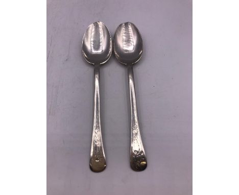 Two silver teaspoons.