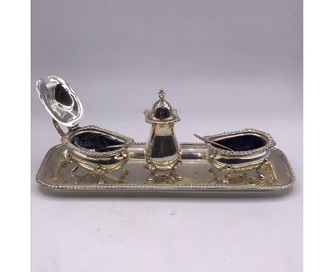 A JBC &amp;S Limited Birmingham 1972-73 silver cruet set on silver tray to include pepper shaker, salt and mustard with blue 