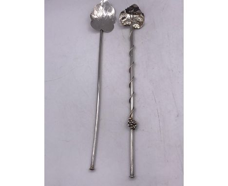 Two Mexican silver stirrers.