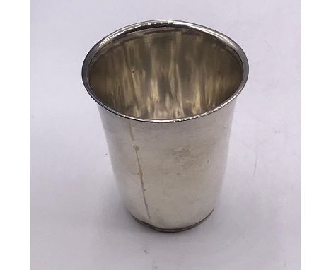 A Persian silver beaker.