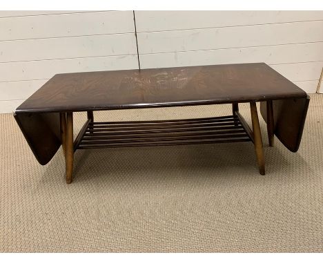 An Ercol Elm coffee table (H36cm W105cm D27cm)