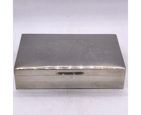 An engraved silver cigarette box, hallmarked Birmingham for Garrard and Co.