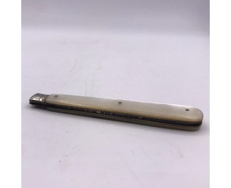 A silver fruit knife with a mother of pearl handle.