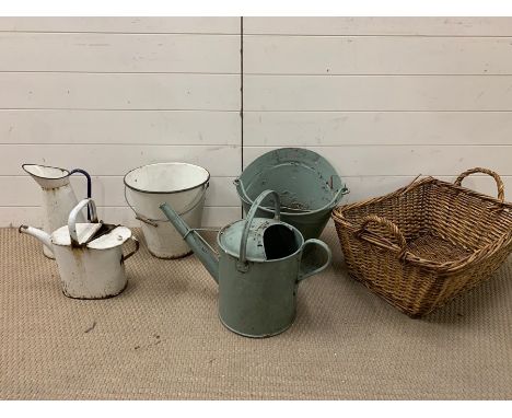 A selection of enamel and metal buckets and jugs, along with a wicker basket 
