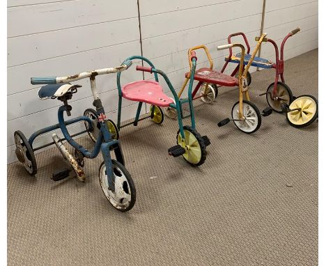 Four vintage children's trikes 