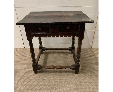 A Late 17th Century oak side table, rectangular top on block and ring turned legs, joined by stretchers. W 70cm x D 50 cm x H