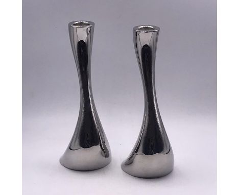 A pair of Gerog Jensen tea light/candle holders 