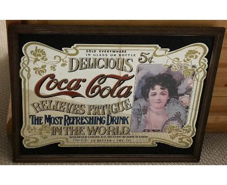 A vintage "Coca-Cola Relieves Fatigue(...)" advert-hanging mirror with wooden frame (50x65 cm)