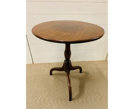 A mahogany tilt top occasional table on tripod legs (H68cm W60cm D60cm)