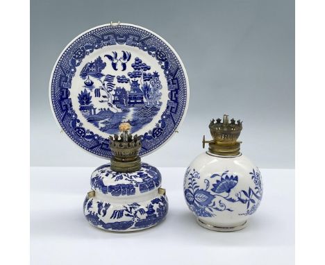 Features one ceramic oil lamp and reflector plate mounted on a matching stand, and one ceramic lamp marked Chadwick Japan. La