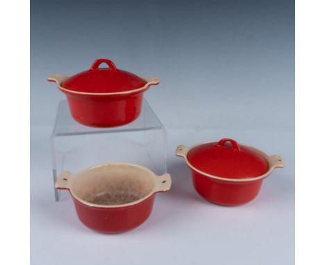 This charming grouping includes three small cast iron pots, beautifully enameled in tan and reddish-orange hues. Perfectly si