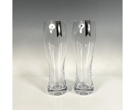 Unique, contemporary design of two glasses featuring detailed shape lines, from Elegance collection. Waterford stickers and W