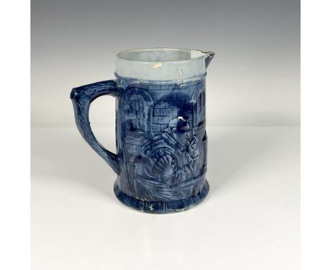 Beautiful deep blue colored stoneware pitcher. It depicts monks in a seminary in relief. Dimensions: 8.5"L x 6"W x 8.5"HCondi