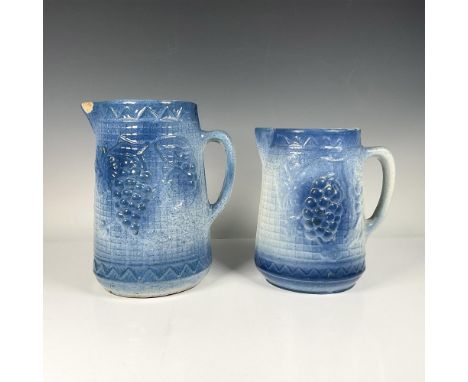 Two beautiful stoneware pitchers with a grapevine and thatch design. Each stamped with a star on the bottom. The larger pitch