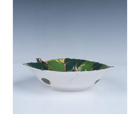 A dazzling decorative gilded bowl molded in the shape of a leaf, featuring the stem as a handle. Lynn China backstamp. This i